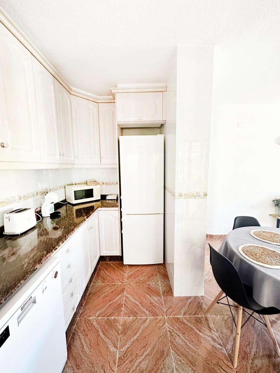 Kitchen or kitchenette, dishwasher, oven, stove, toaster
