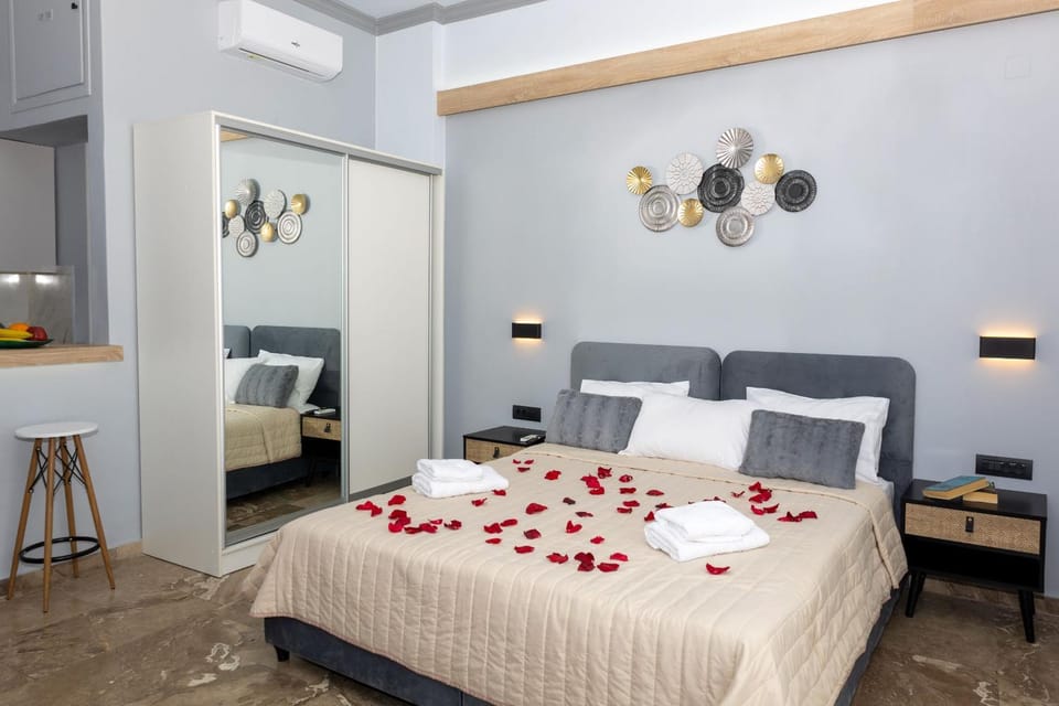 Bed, towels, wardrobe, air conditioner
