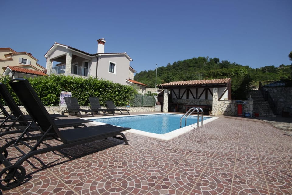 Property building, Patio, Pool view, Swimming pool, sunbed