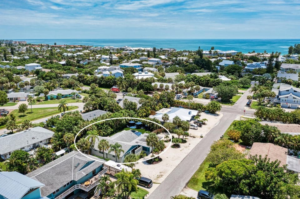 One Day More: Spectacular Oasis Backyard with Pool & Spa by Anna Maria Life Vacation Rentals House in Holmes Beach