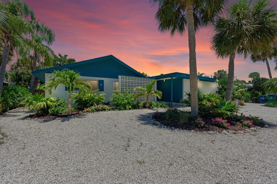 One Day More: Spectacular Oasis Backyard with Pool & Spa by Anna Maria Life Vacation Rentals House in Holmes Beach