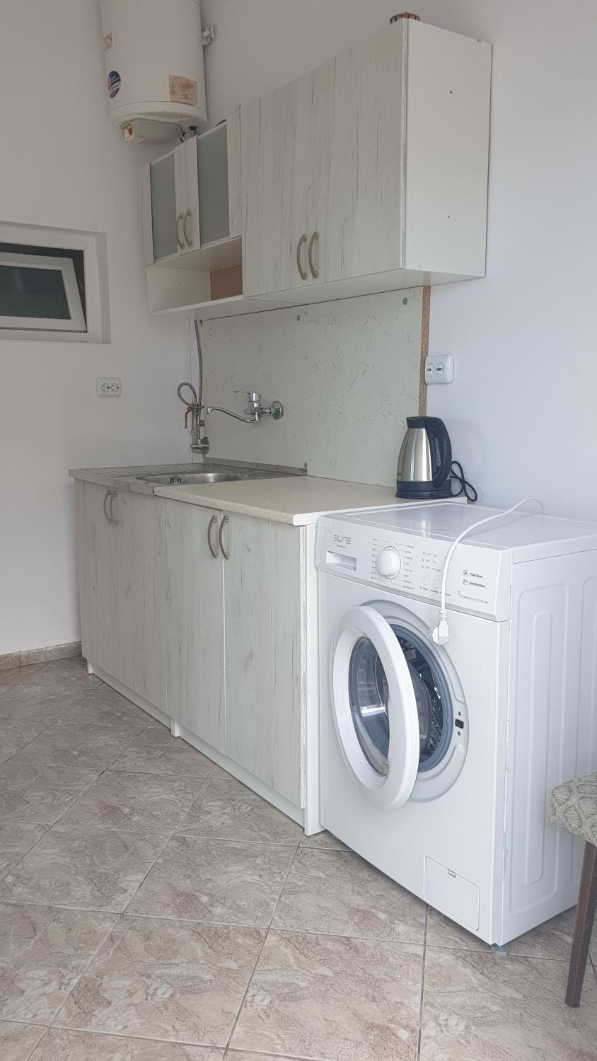 Kitchen or kitchenette, washing machine