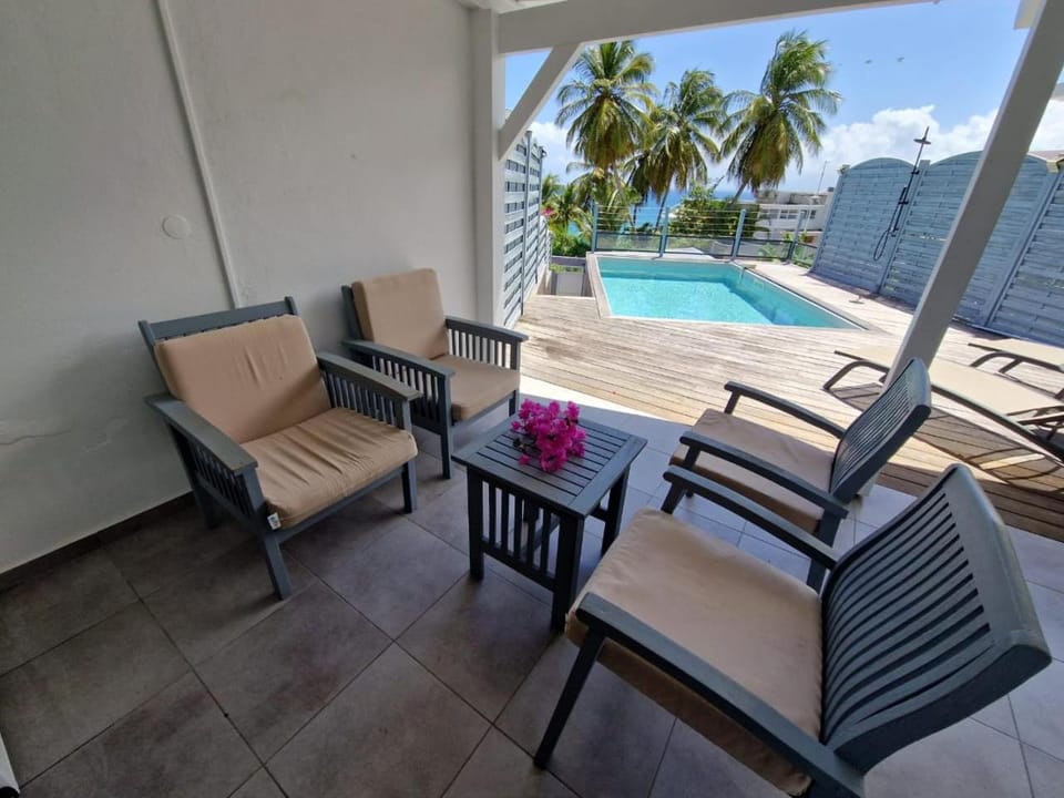 Patio, Seating area, Sea view, Swimming pool