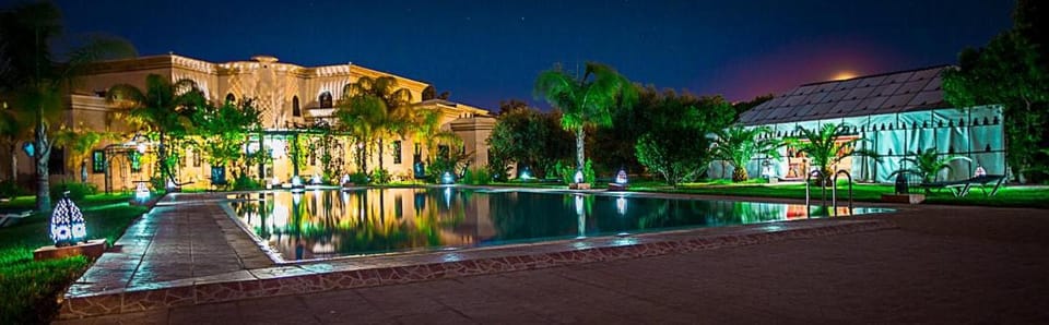 Property building, Night, Natural landscape, Garden, Garden view, Pool view, Swimming pool