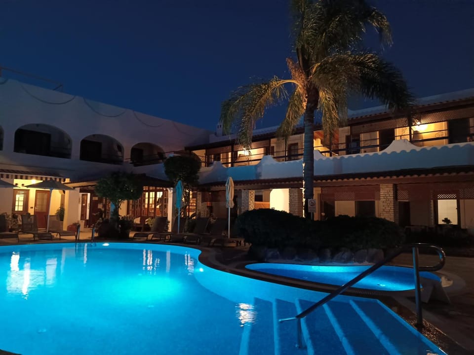 Property building, Night, Pool view, Swimming pool, sunbed