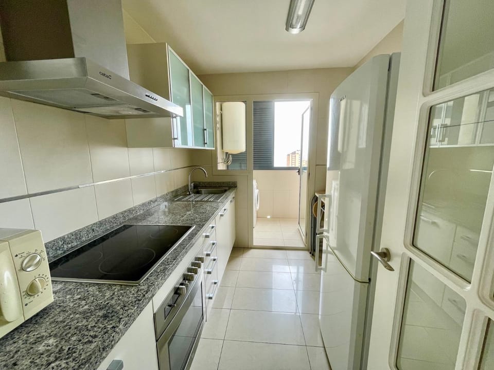 Kitchen or kitchenette, washing machine