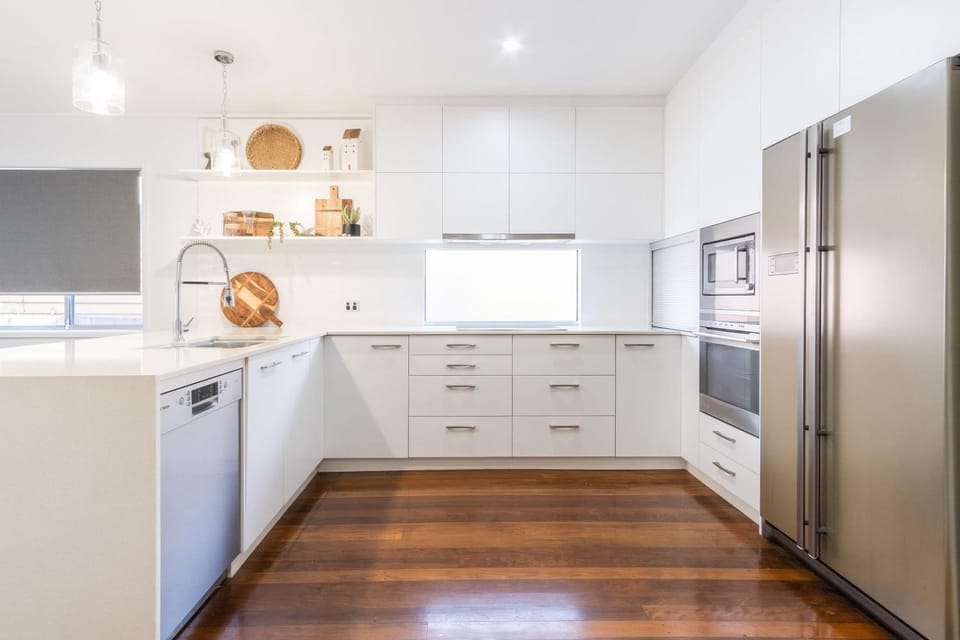 Kitchen or kitchenette, dishwasher, oven, stove