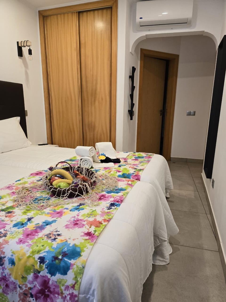 Bed, Bedroom, hair dryier, towels, wardrobe, air conditioner
