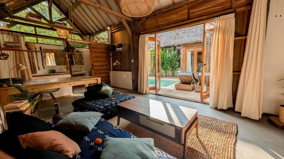 Living room, Seating area, Pool view