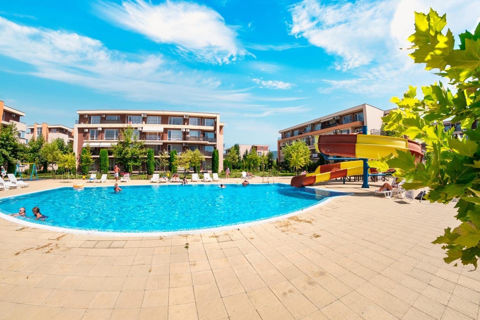 Property building, Day, Aqua park, Pool view, Swimming pool