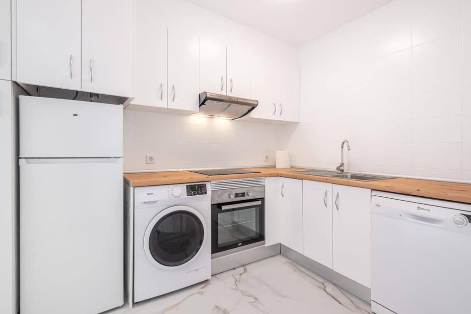 Kitchen or kitchenette, dishwasher, oven, stove, washing machine