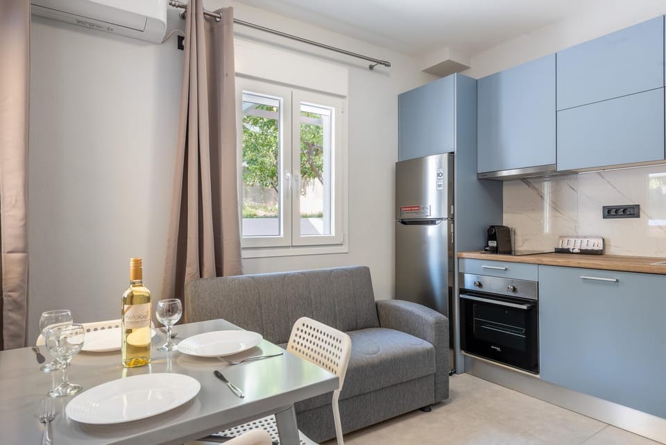 Kitchen or kitchenette, dishwasher, oven, stove