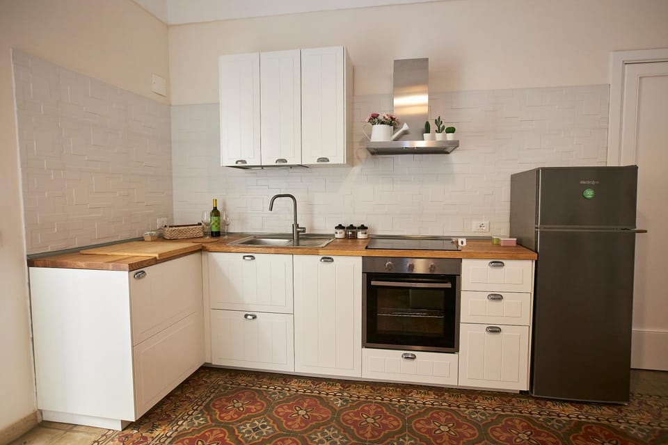 Kitchen or kitchenette, dishwasher, oven, stove