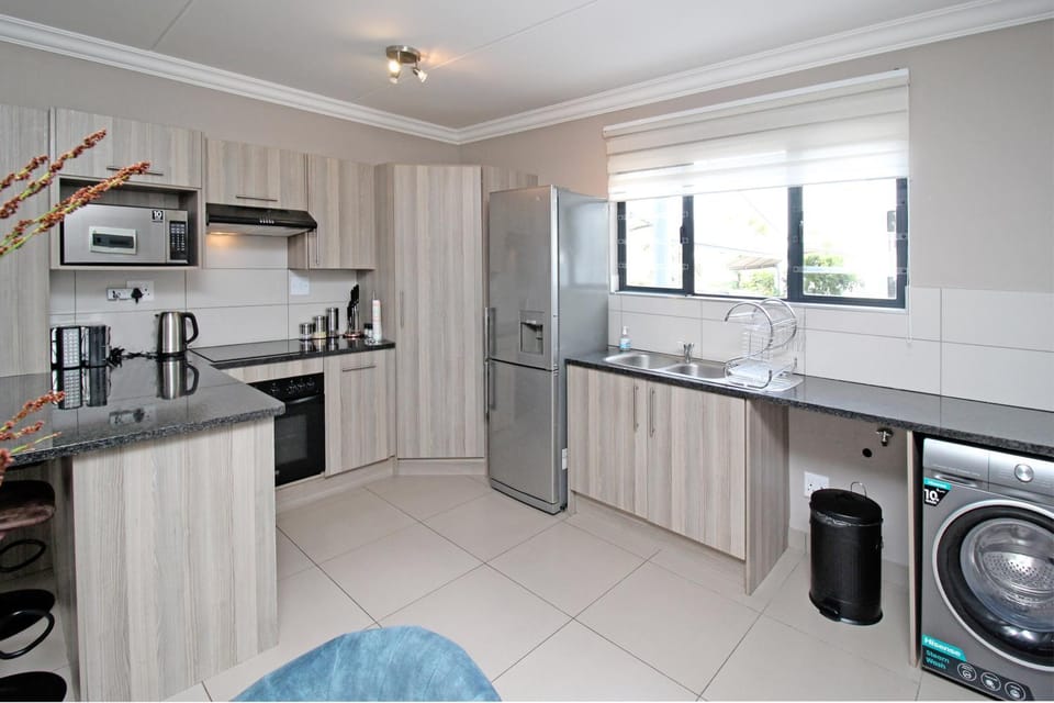 Kitchen or kitchenette, oven, stove, toaster, washing machine