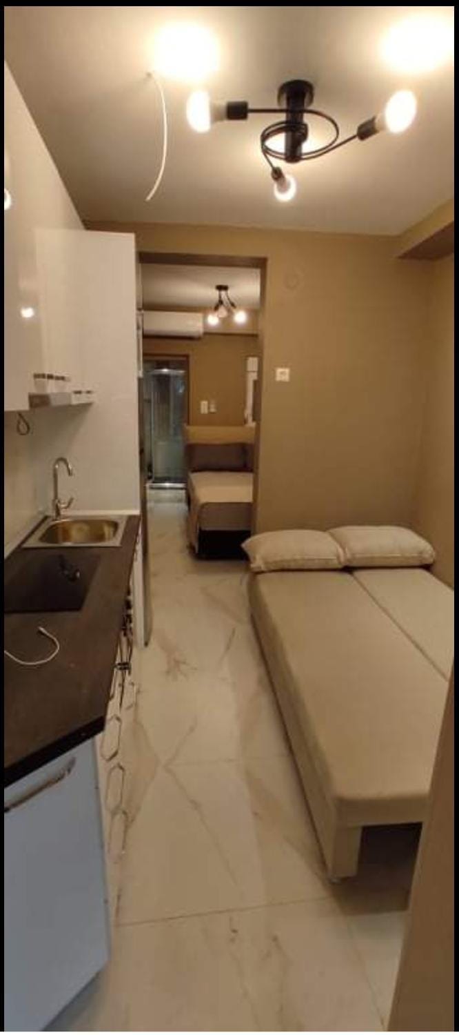 Bed, Kitchen or kitchenette, Living room, Seating area, air conditioner, air conditioner