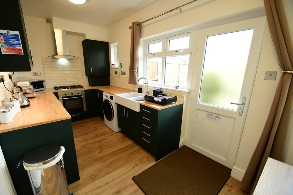 microwave, oven, stove, toaster, washing machine, kitchen, kitchen