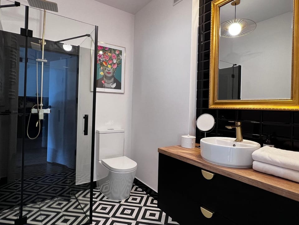 Shower, Toilet, Bathroom, hair dryier, towels