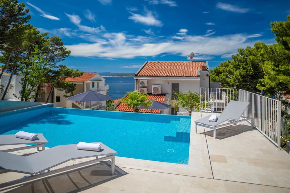 Property building, Patio, Sea view, Swimming pool, sunbed