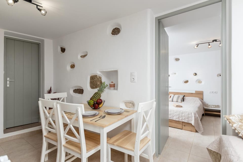 Bed, Living room, Seating area, Dining area