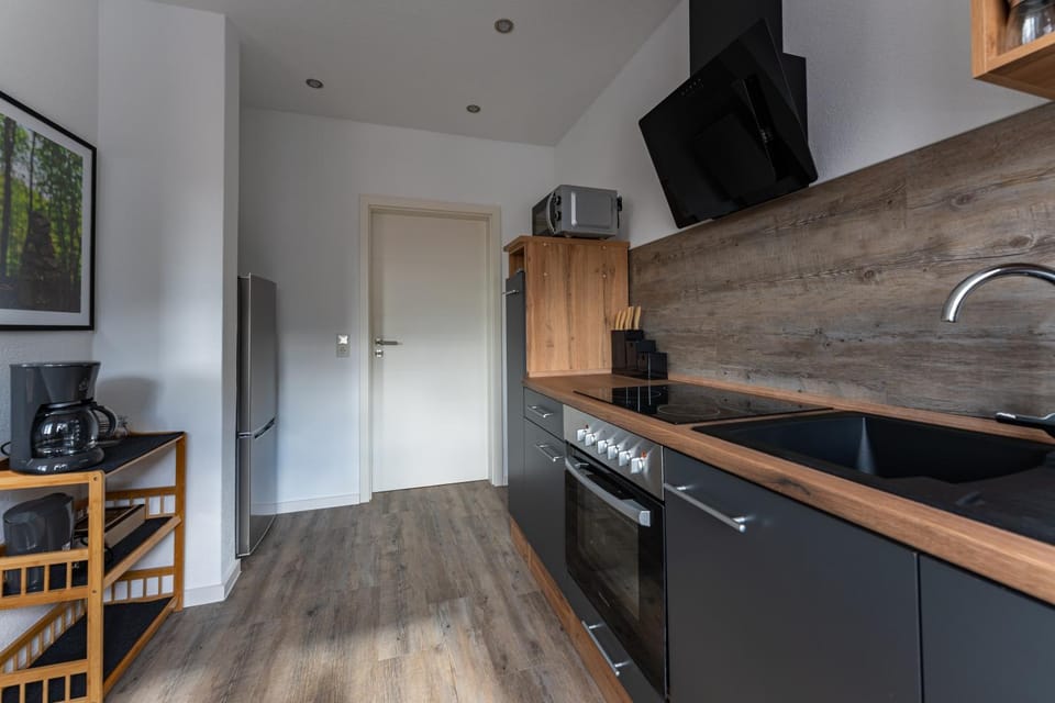Kitchen or kitchenette, dishwasher, oven, stove