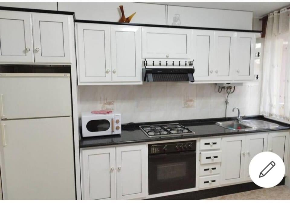 Kitchen or kitchenette, stove, toaster