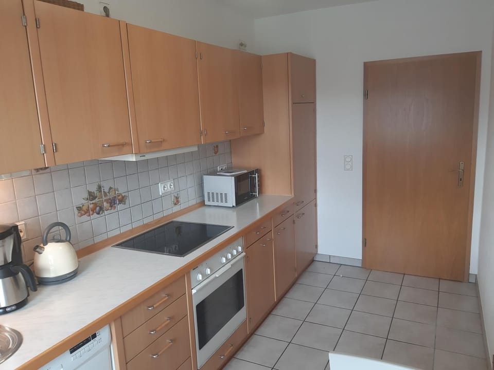 Kitchen or kitchenette, dishwasher, oven, stove, toaster