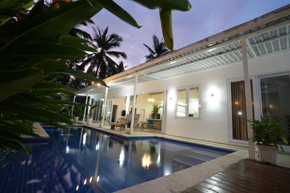 Property building, Patio, Night, Pool view, Swimming pool, sunbed