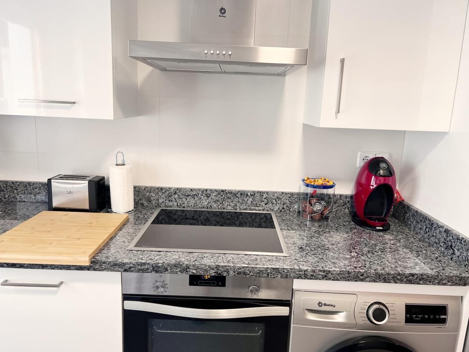 Kitchen or kitchenette, dishwasher, stove, toaster