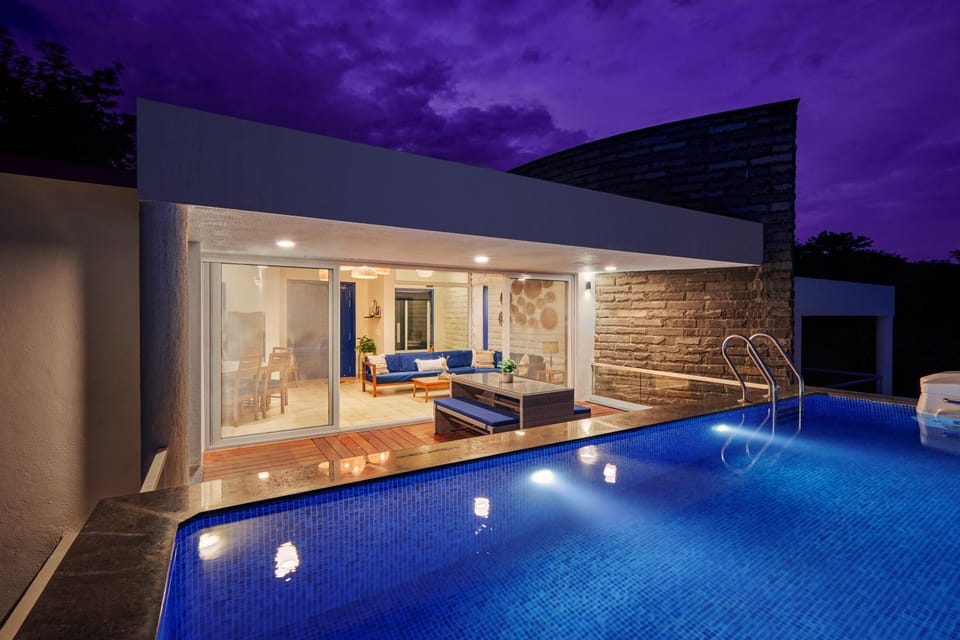Property building, Patio, Night, Living room, Lake view, Mountain view, Pool view, Swimming pool, towels
