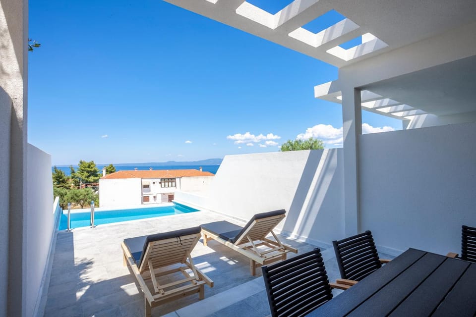 Patio, Day, View (from property/room), Pool view, Sea view, Swimming pool, sunbed