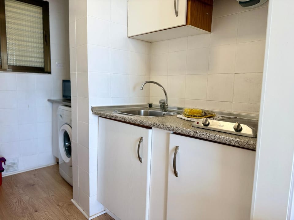 Kitchen or kitchenette, washing machine