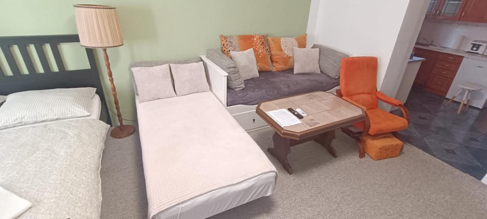 Bed, Living room, Seating area, Bedroom