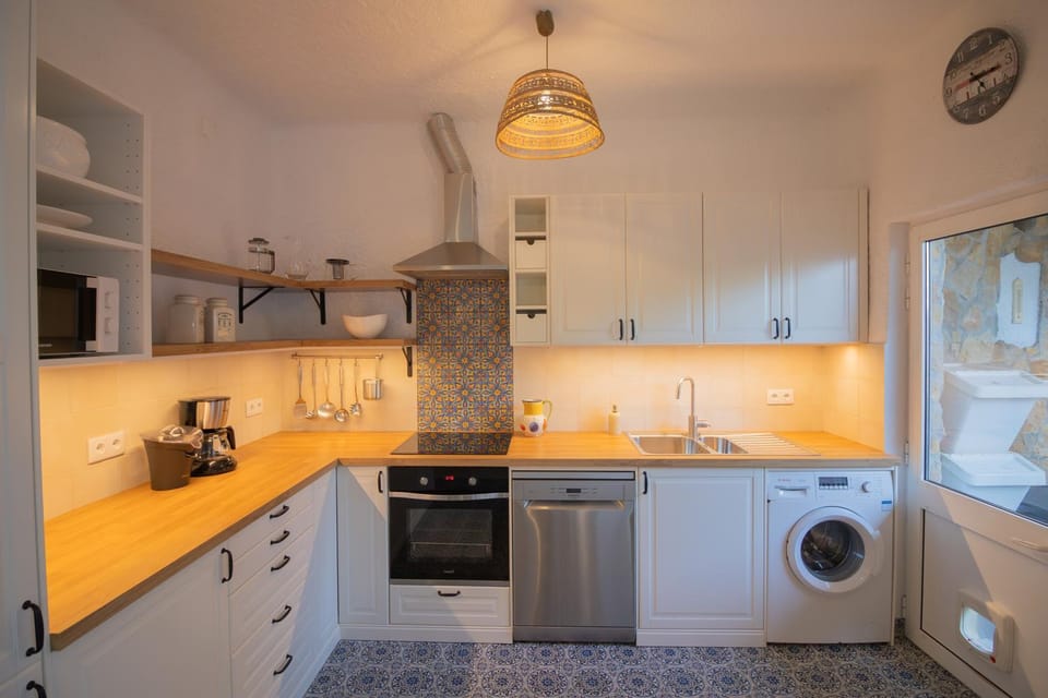 Kitchen or kitchenette, dishwasher, oven, stove, washing machine
