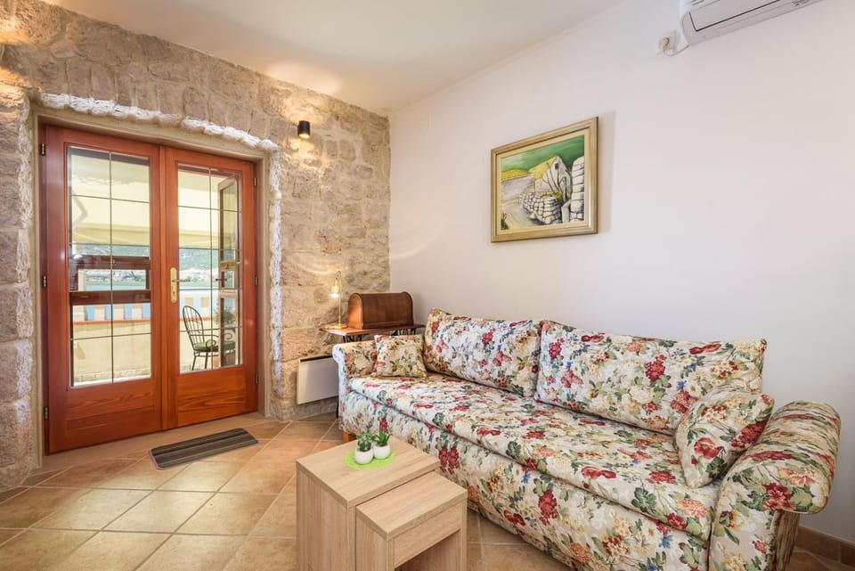 Property building, Living room, Seating area, air conditioner