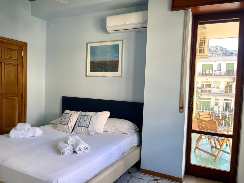 Bed, Photo of the whole room, Bedroom, towels, air conditioner