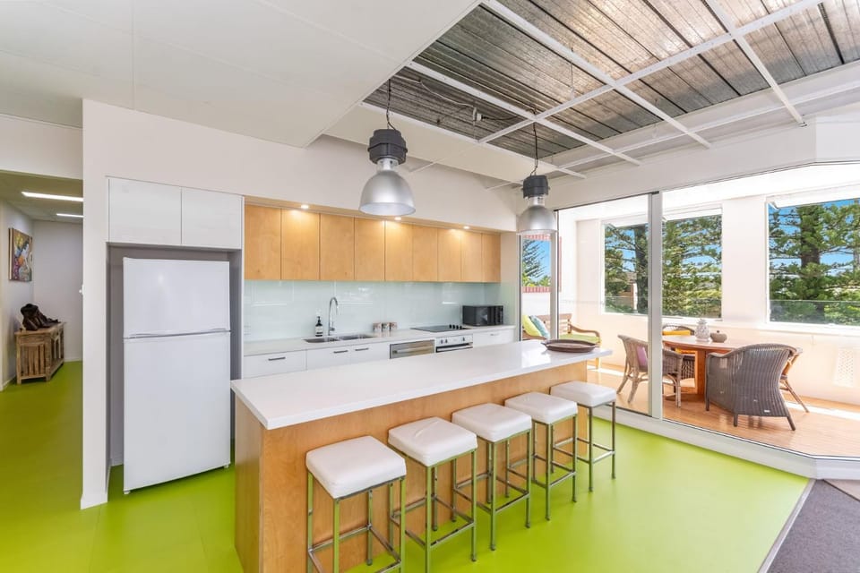 Kitchen or kitchenette, dishwasher, oven, stove