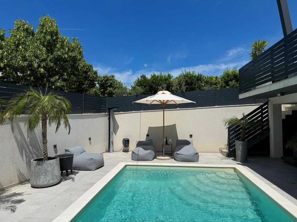 Patio, Day, Seating area, Pool view, Swimming pool, sunbed