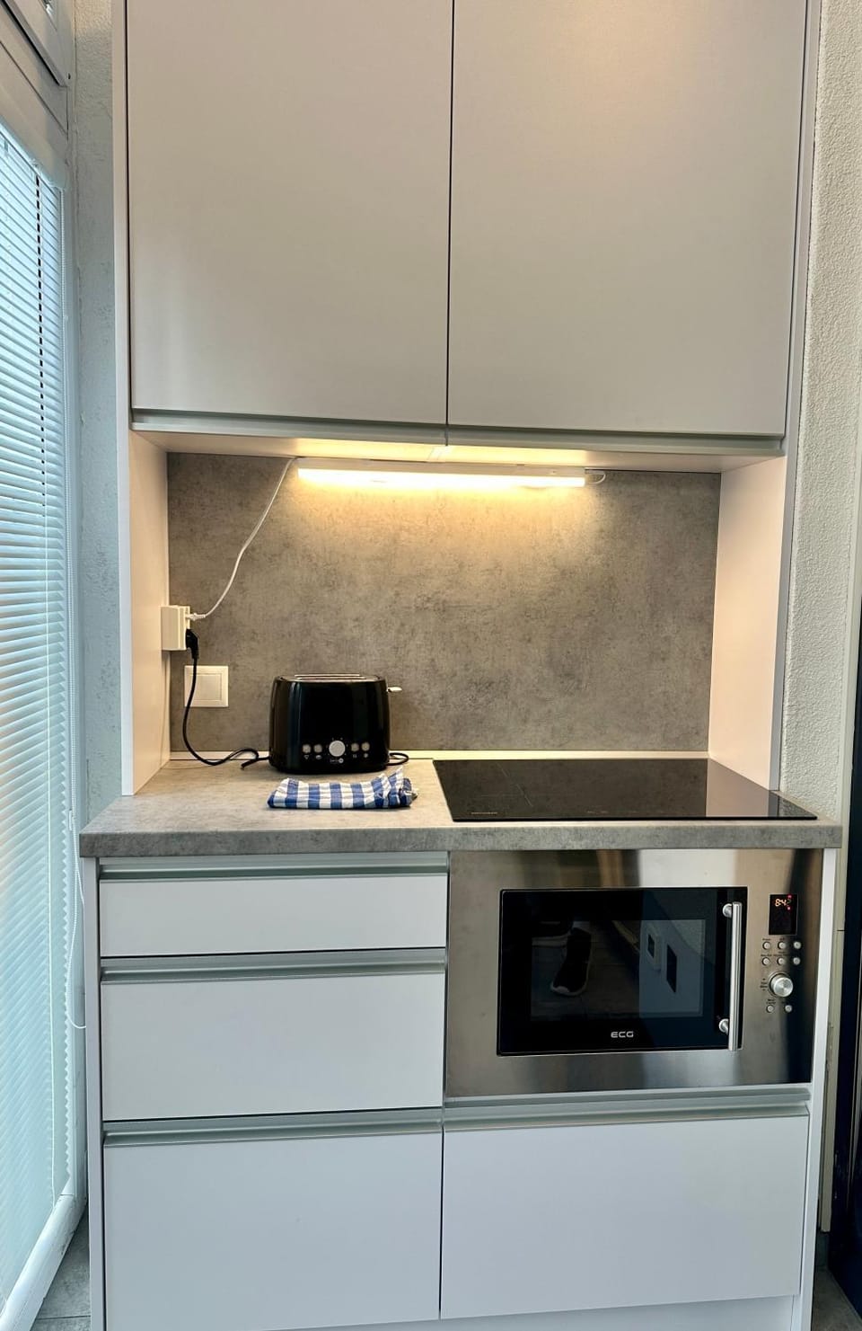 Kitchen or kitchenette, stove, toaster