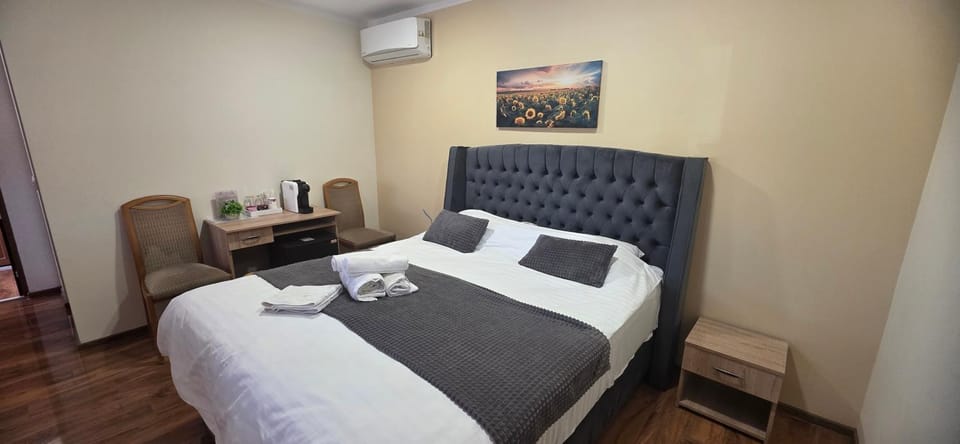 Photo of the whole room, Bedroom, towels, air conditioner