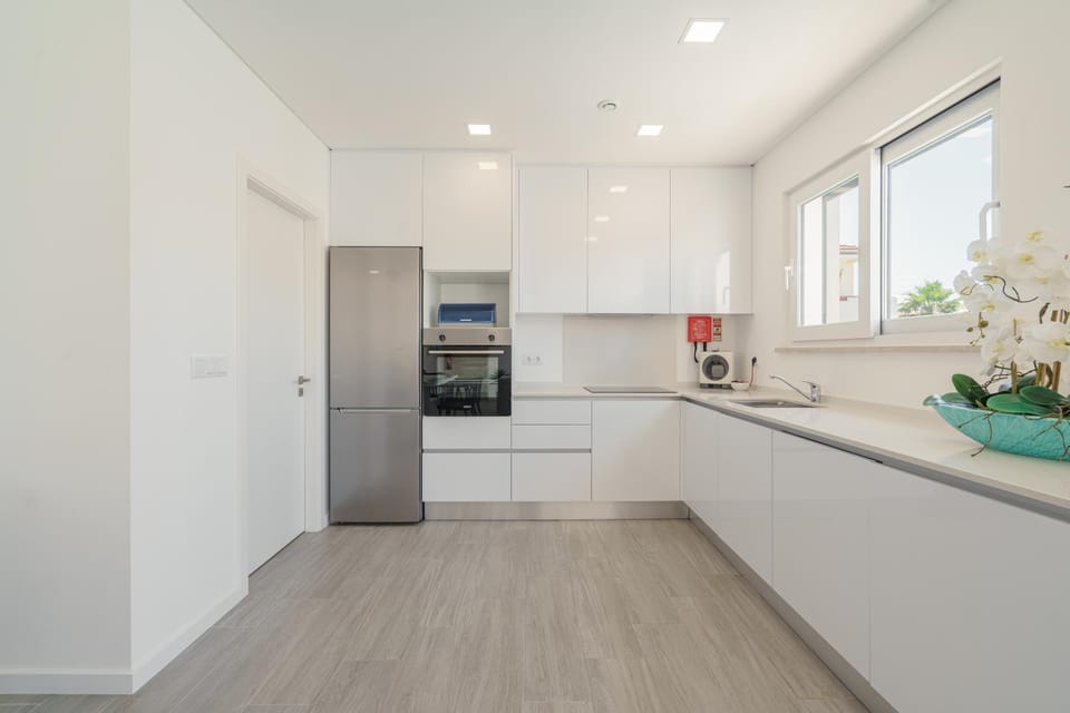 Kitchen or kitchenette, dishwasher, oven, stove