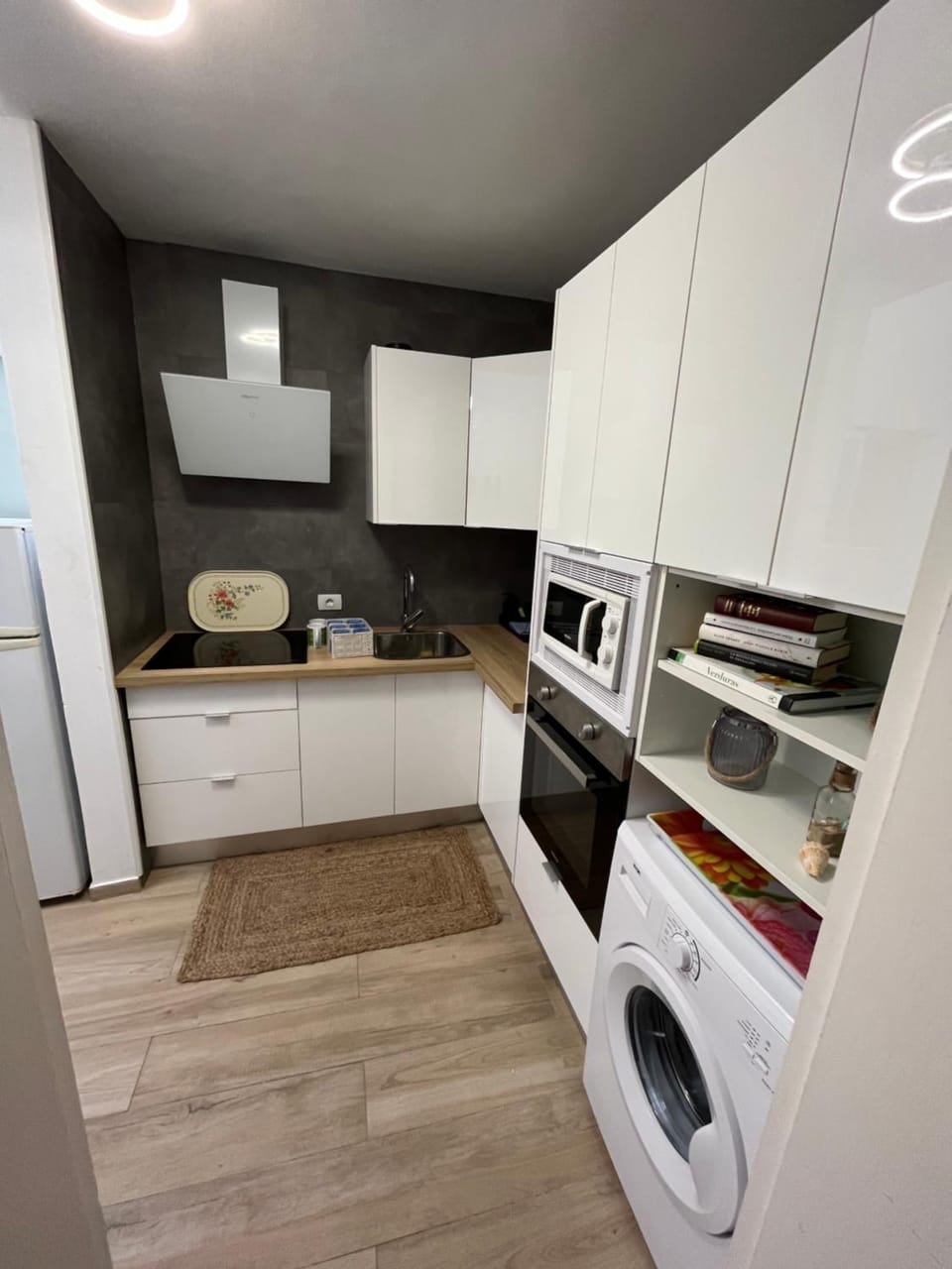 Kitchen or kitchenette, oven, stove, washing machine