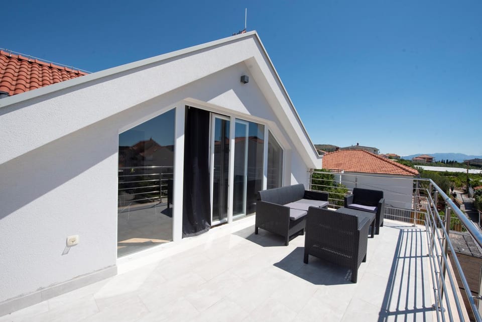 Sunny attic apartment with balcony & Modern city apartment with outdoor area, no balcony Apartment in Trogir