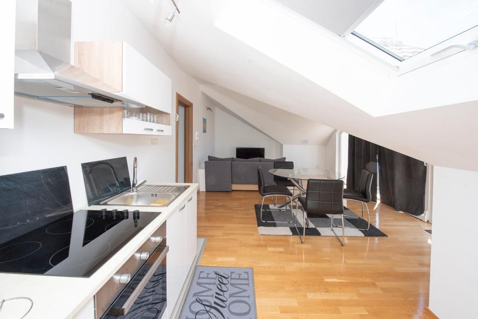Sunny attic apartment with balcony & Modern city apartment with outdoor area, no balcony Apartment in Trogir