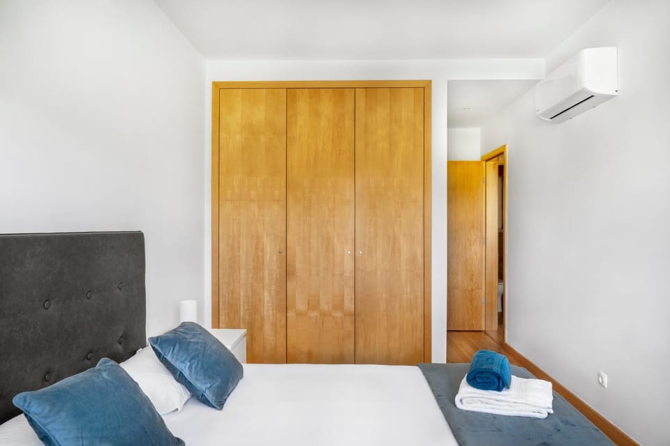 Bed, Bedroom, towels, wardrobe, air conditioner