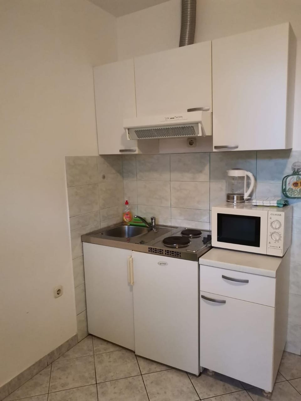 Kitchen or kitchenette, microwave