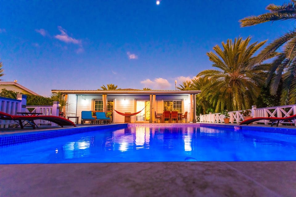 Property building, Natural landscape, Pool view, Swimming pool, sunbed