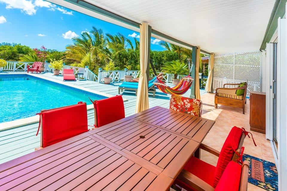 Patio, Day, Balcony/Terrace, Living room, Seating area, Pool view, Swimming pool, sunbed