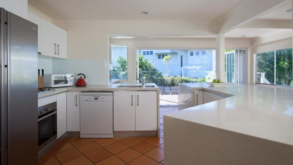 Kitchen or kitchenette, dishwasher, oven, stove