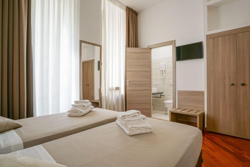 Photo of the whole room, towels, wardrobe, air conditioner