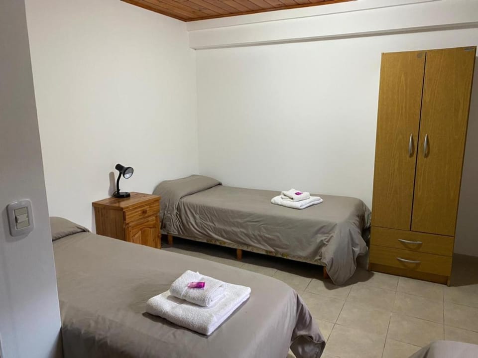 Bed, towels, wardrobe